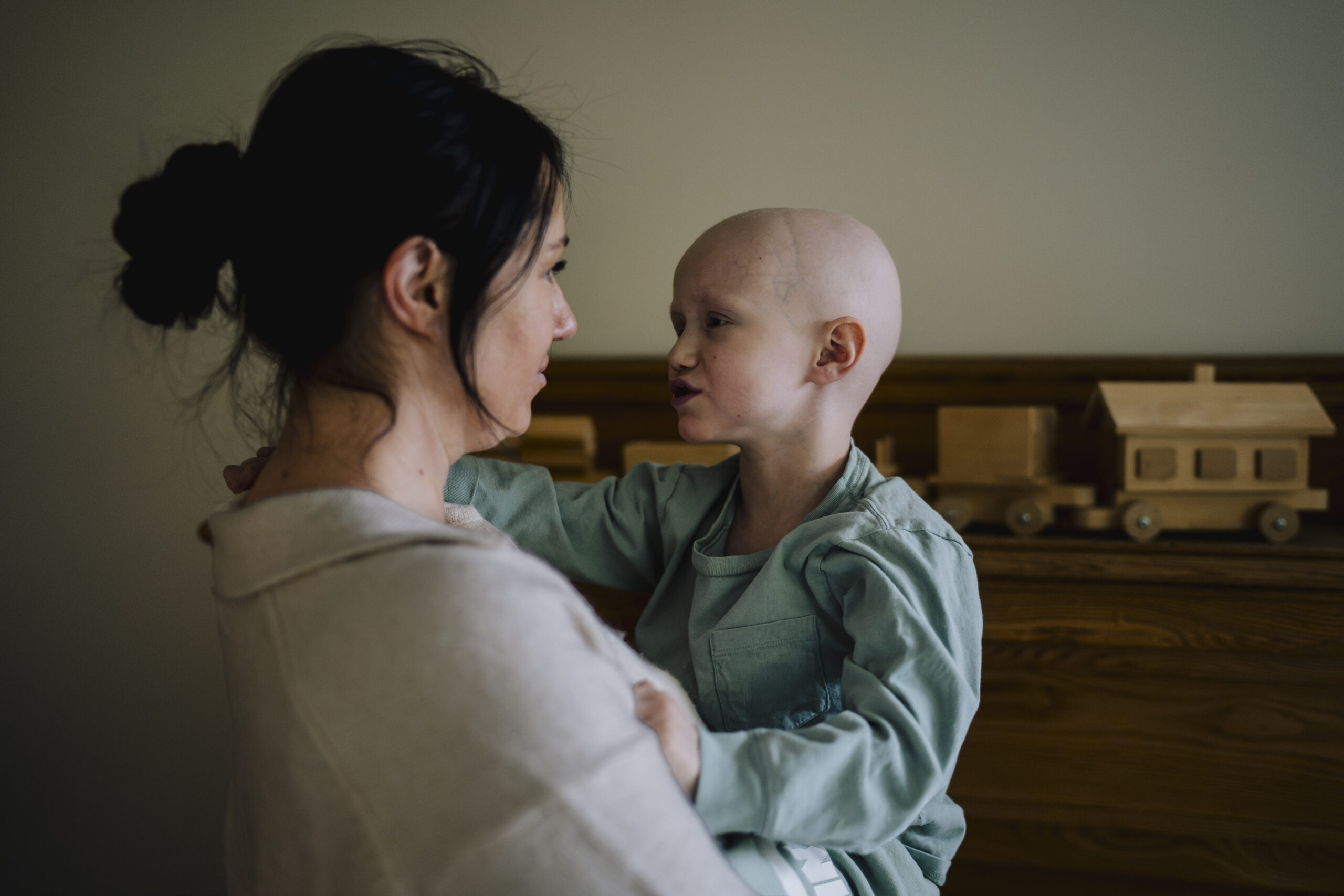 Parent holding a child in the hospital
